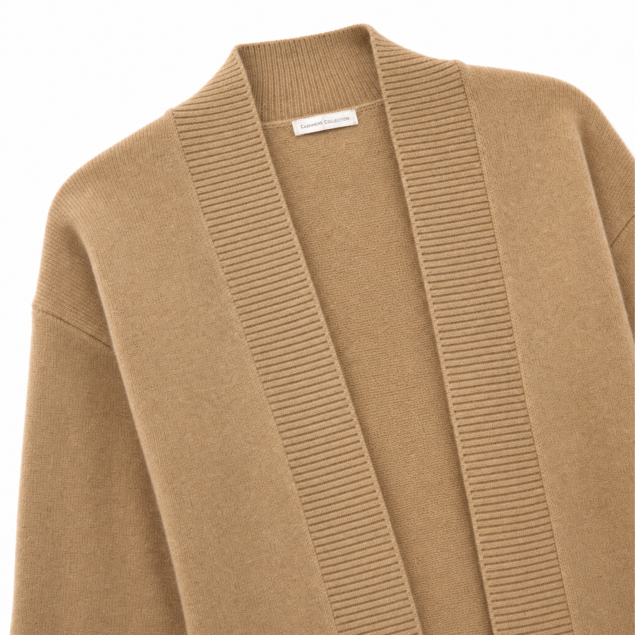 A close-up of a camel-colored knit cardigan with a ribbed V-neck trim and a small white brand label at the collar.